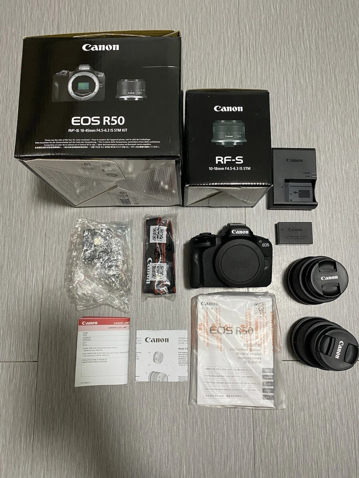 Cámara mirrorless Canon EOS R50 con lentes 18–45mm y 10–18mm